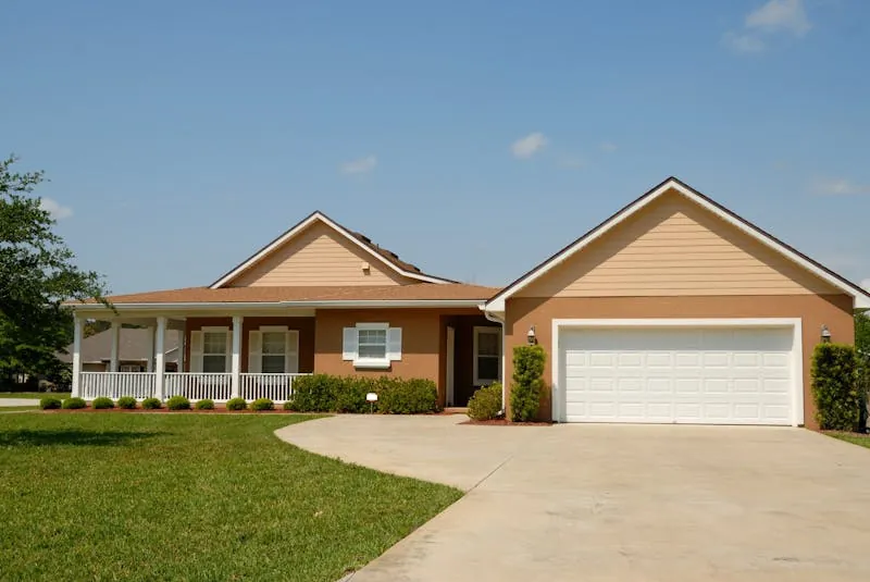 Professional garage door technician servicing a residential garage in Maryland